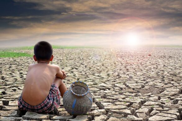 A Boy Sitting With Pot On A Barren Land Due To Climate Change And Looking Towards Sun I Itmunch