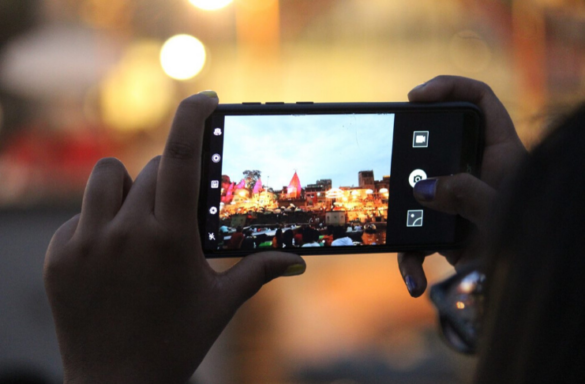 A Person Clicking Picture On The Phone | Itmunch