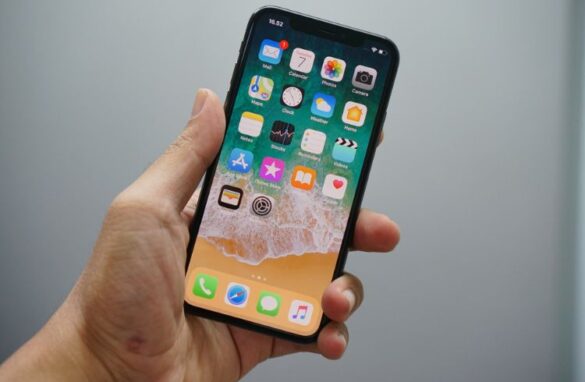 A Man Holding The Iphone